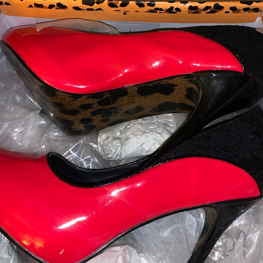 Size 10 Bettie page high heels. Never worn but has a black scuff from box.